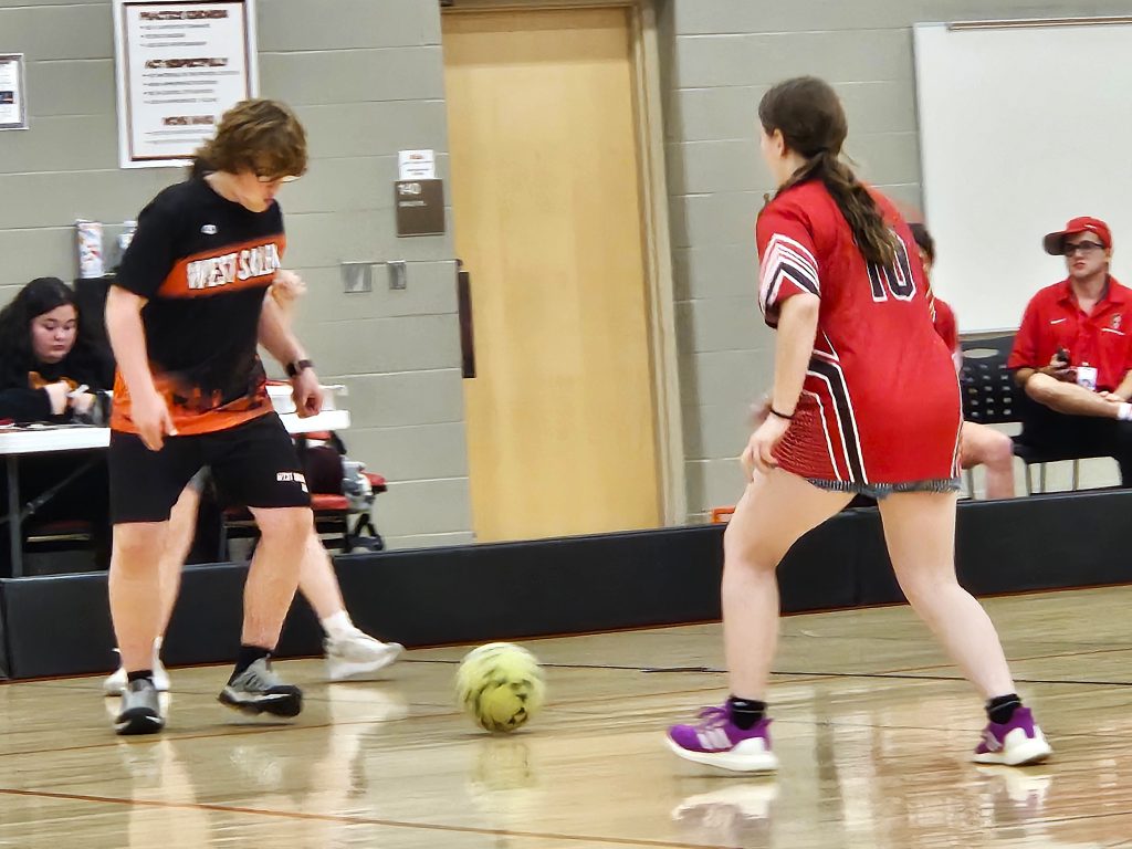 Logan's Neveah Dyon pressures the ball controlled by West Salem/Bangor's David Chandler in their ASL soccer game. -- TODD SOMMERFELDT PHOTO