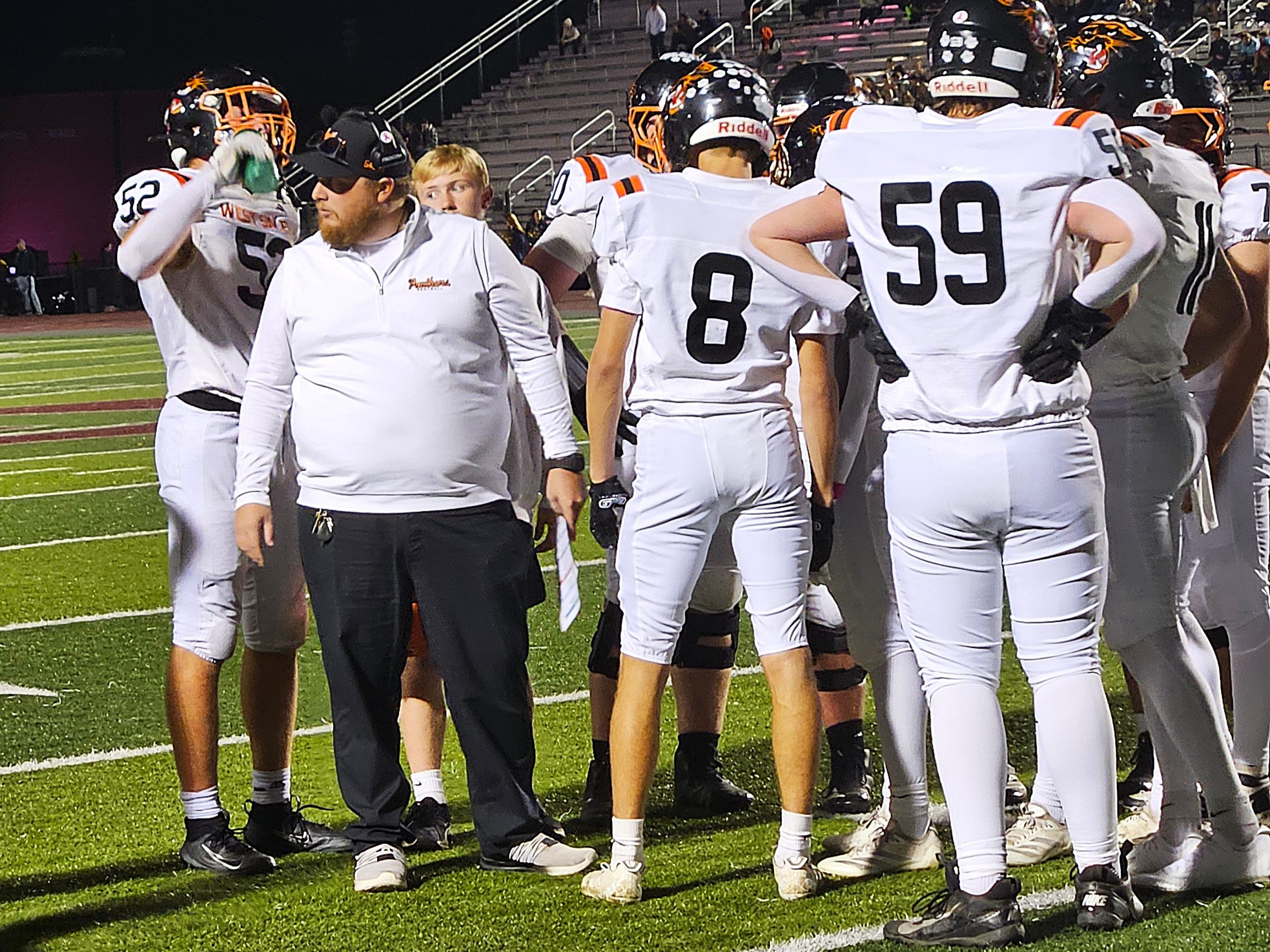 West Salem football coach Ryan Olson looks to the sideline as his team talks during a break in the action. -- TODD SOMMERFELDT PHOTO