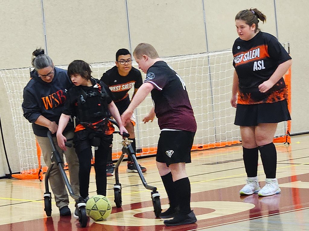 Opponents battle over a live ball during Monday's ASL soccer tournament championship game at the Bernie L. Ferry Fieldhouse in Holmen. -- TODD SOMMERFELDT PHOTO