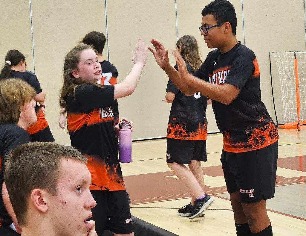 West Salem/Bangor teammates Levi Wulf and Emma Field exchange high-fives during Monday's ASL tournament soccer championship game against Holmen at the Bernie L. Ferry Fieldhouse. -- TODD SOMMERFELDT PHOTO