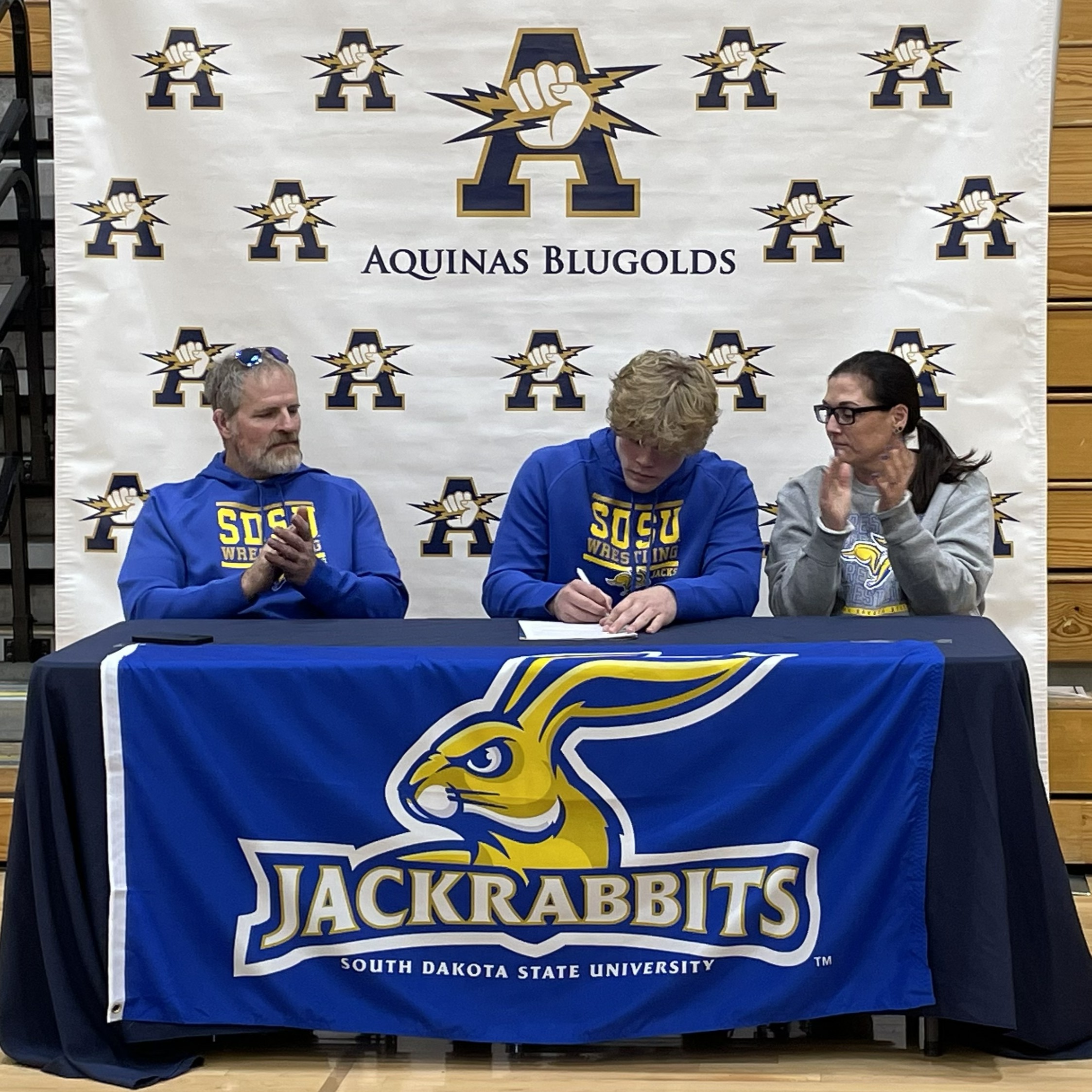 Aquinas senior Tyson Martin signed on Wednesday his Letter of Intent to wrestle for South Dakota State. Martin has a career record of 118-10 and two WIAA Division 3 runner-up finishes. -- SUBMITTED PHOTO