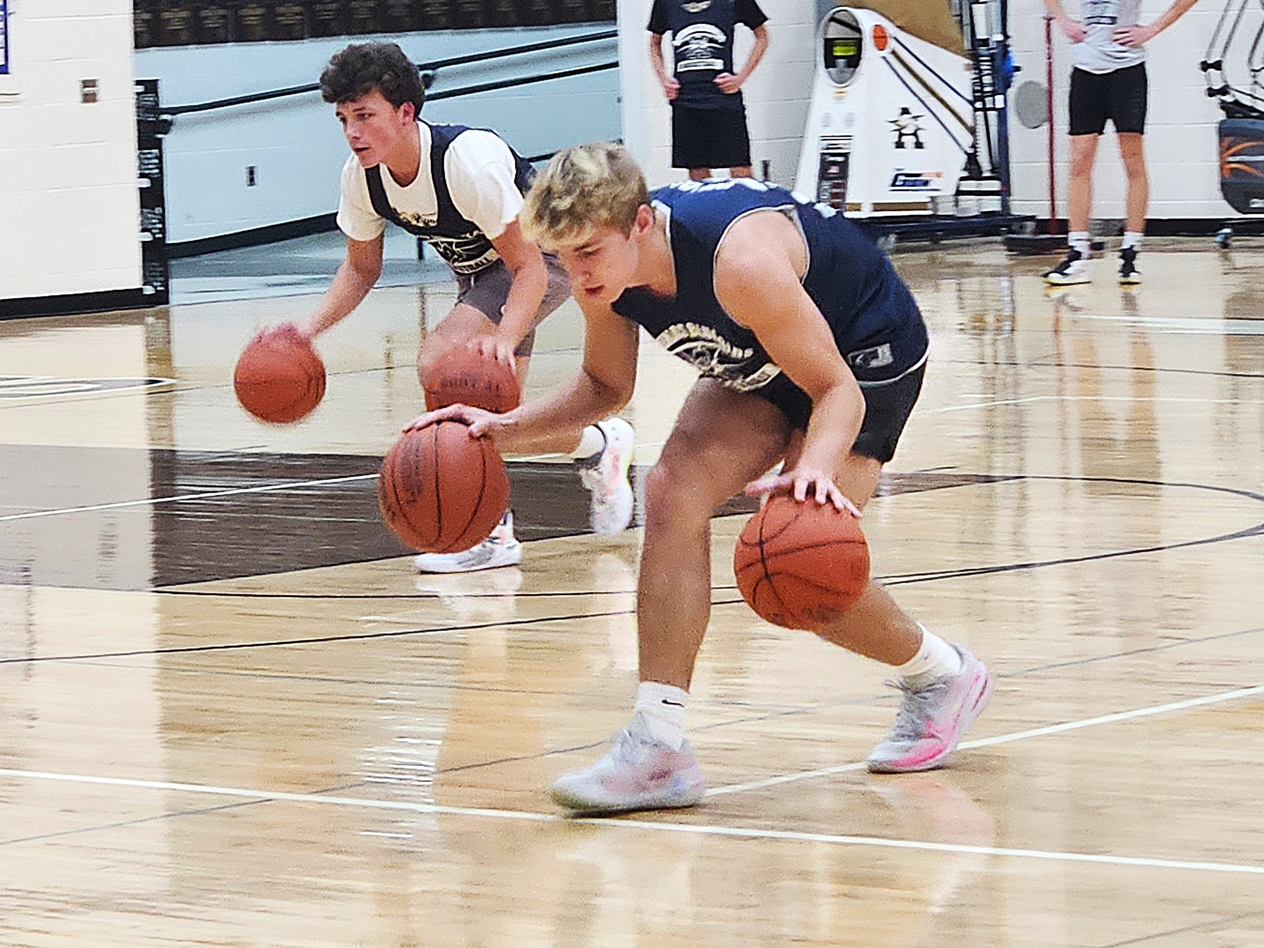 Senior Logan Becker walks through a drill at the first day of the Aquinas boys basketball team's first practice. -- TODD SOMMERFELDT PHOTO