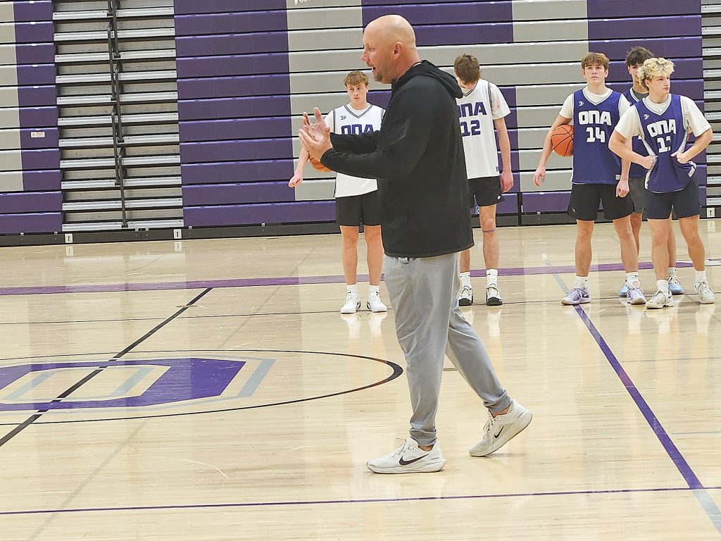 Onalaska boys basketball coach Craig Kowal talks to his Hilltoppers during the first day of practice. -- TODD SOMMERFELDT PHOTO
