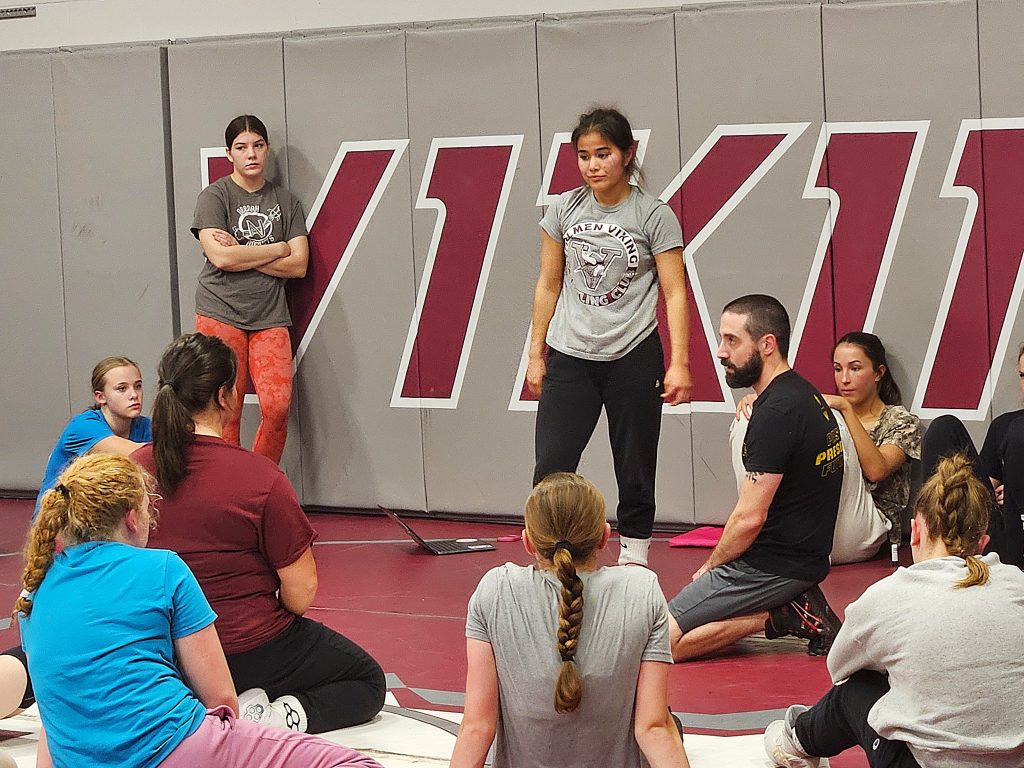 Holmen girls wrestling coach Carl DeLuca talks to his team during the first practice of the season. -- TODD SOMMERFELDT PHOTO