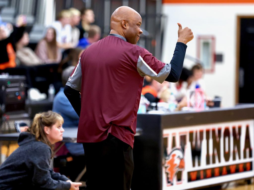 Holmen girls basketball coach Lionel Jones responds to what he sees as the Vikings open their season against Winona. -- CRAIG JOHNSON PHOTO
