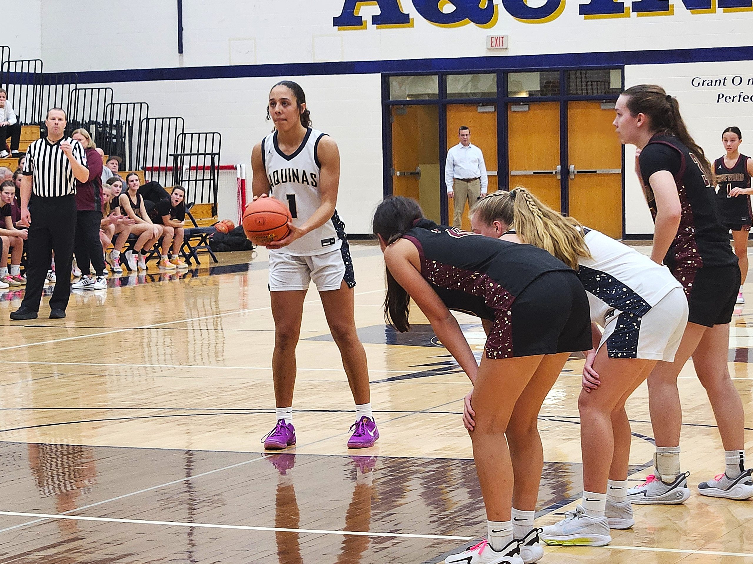 Aquinas senior Sammy Davis prepares to shoot a free throw against Madison Edgewood on Tuesday. -- TODD SOMMERFELDT PHOTO