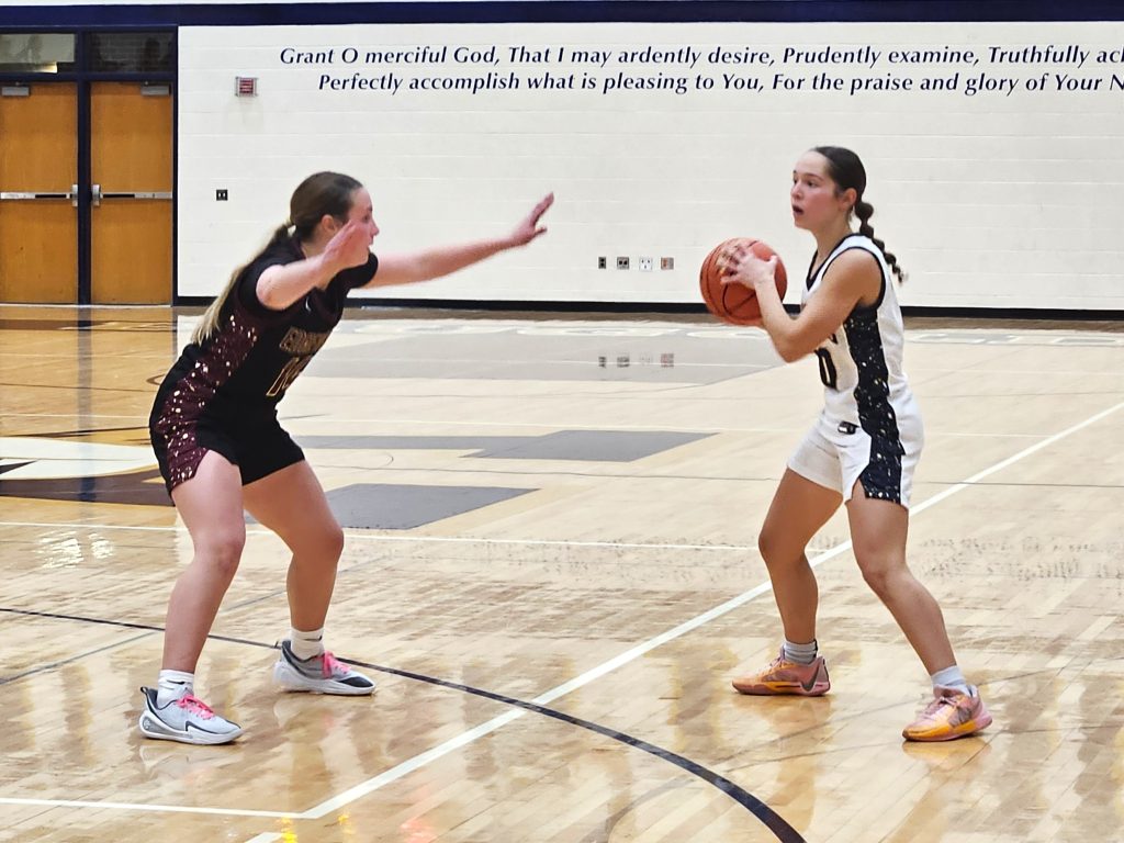 Aquinas junior Eva Willenbring looks to pass against Madison Edgewood on Tuesday. -- TODD SOMMERFELDT PHOTO