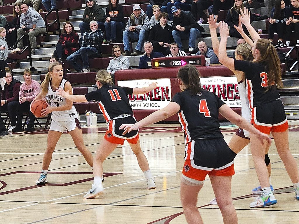 Holmen senior Macy Kline tries to get a pass inside to teammate Charley Casey during Thursday's 57-49 win over West Salem. -- TODD SOMMERFELDT PHOTO