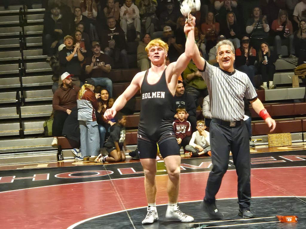 Holmen sophomore Nolan Knapmiller is declared the winner of his 165-pound match against Waverly-Shell Rock (Iowa) on Thursday. -- TODD SOMMERFELDT PHOTO