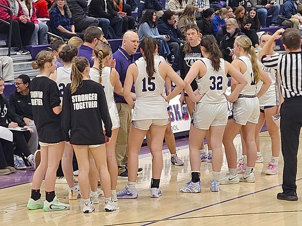The Onalaska girls basketball team talks strategy in a timeout during Thursday's game against visiting Aquinas. -- TODD SOMMERFELDT PHOTO