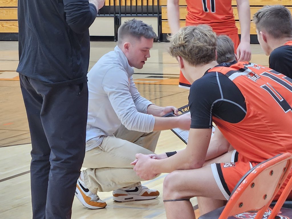 Black River Falls boys basketball coach Jack Taylor talks strategy with his team during Friday's game at West Salem. -- TODD SOMMERFELDT PHOTO