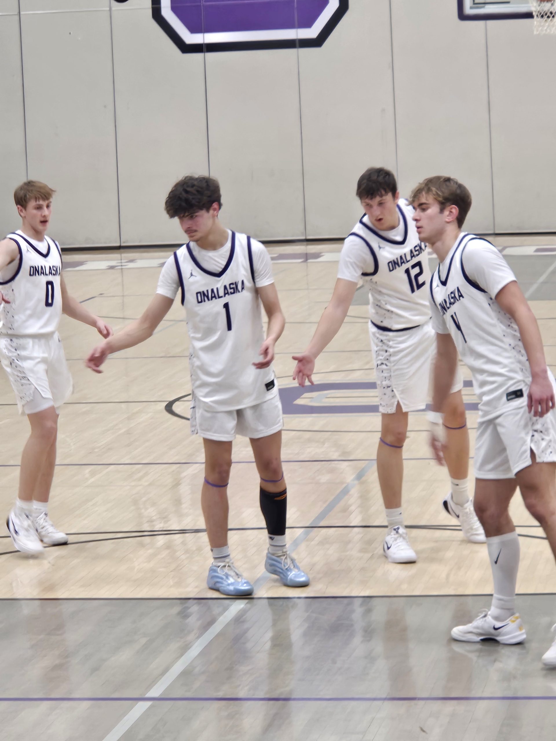 The Onalaska boys basketball team celebrates a free throw in a nonconference win over DeForest. -- TODD SOMMERFELDT PHOTO