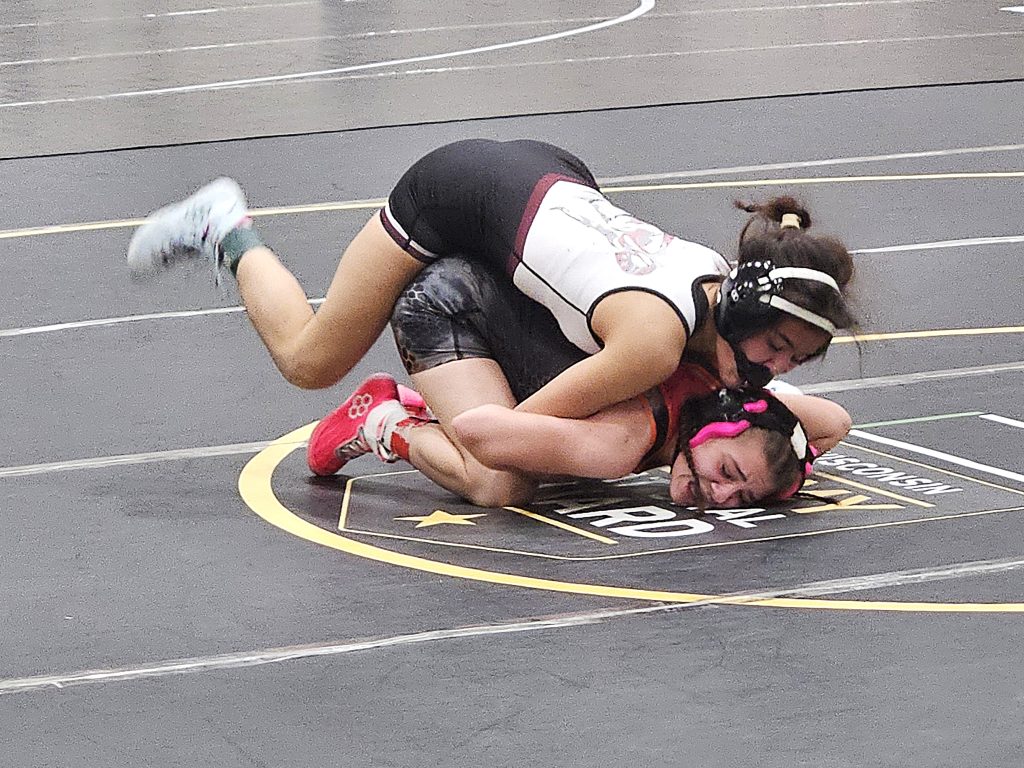 Holmen junior Aini Anderson with the upper hand in her 100-pound quarterfinal match at the Bi-State Classic on Monday. -- TODD SOMMERFELDT PHOTO