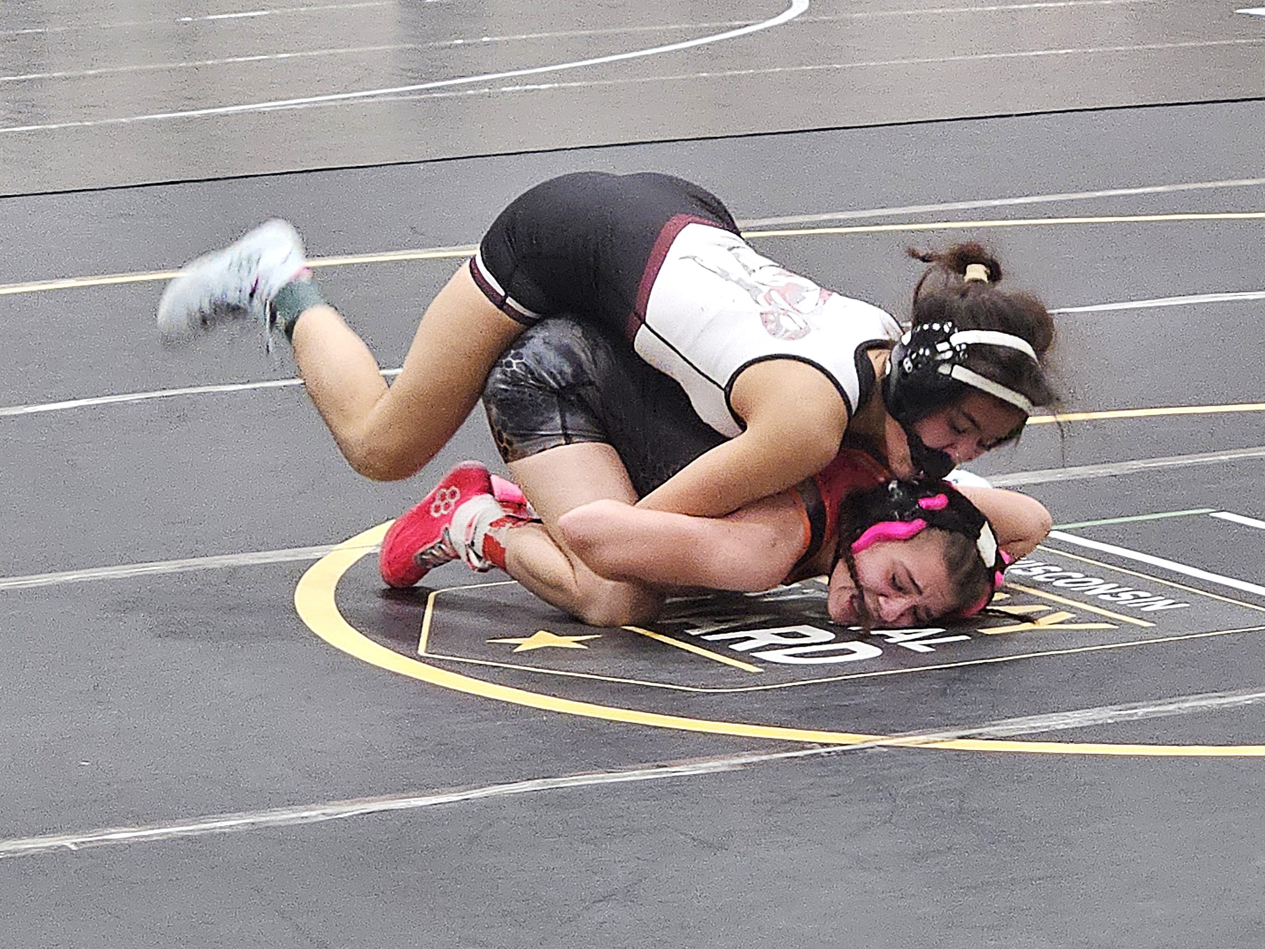Holmen junior Aini Anderson with the upper hand in her 100-pound quarterfinal match at the Bi-State Classic on Monday. -- TODD SOMMERFELDT PHOTO