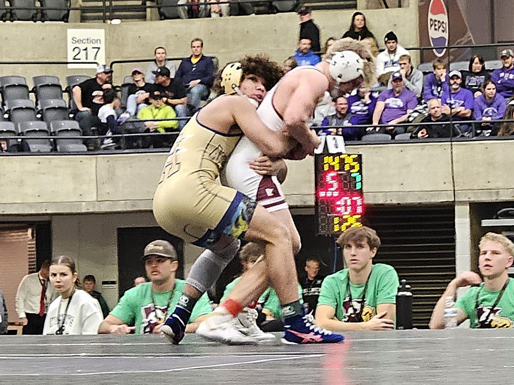 Aquinas sophomore Martez Sheard battles for the 126-pound championship at the Bi-State Classic. -- TODD SOMMERFELDT PHOTO