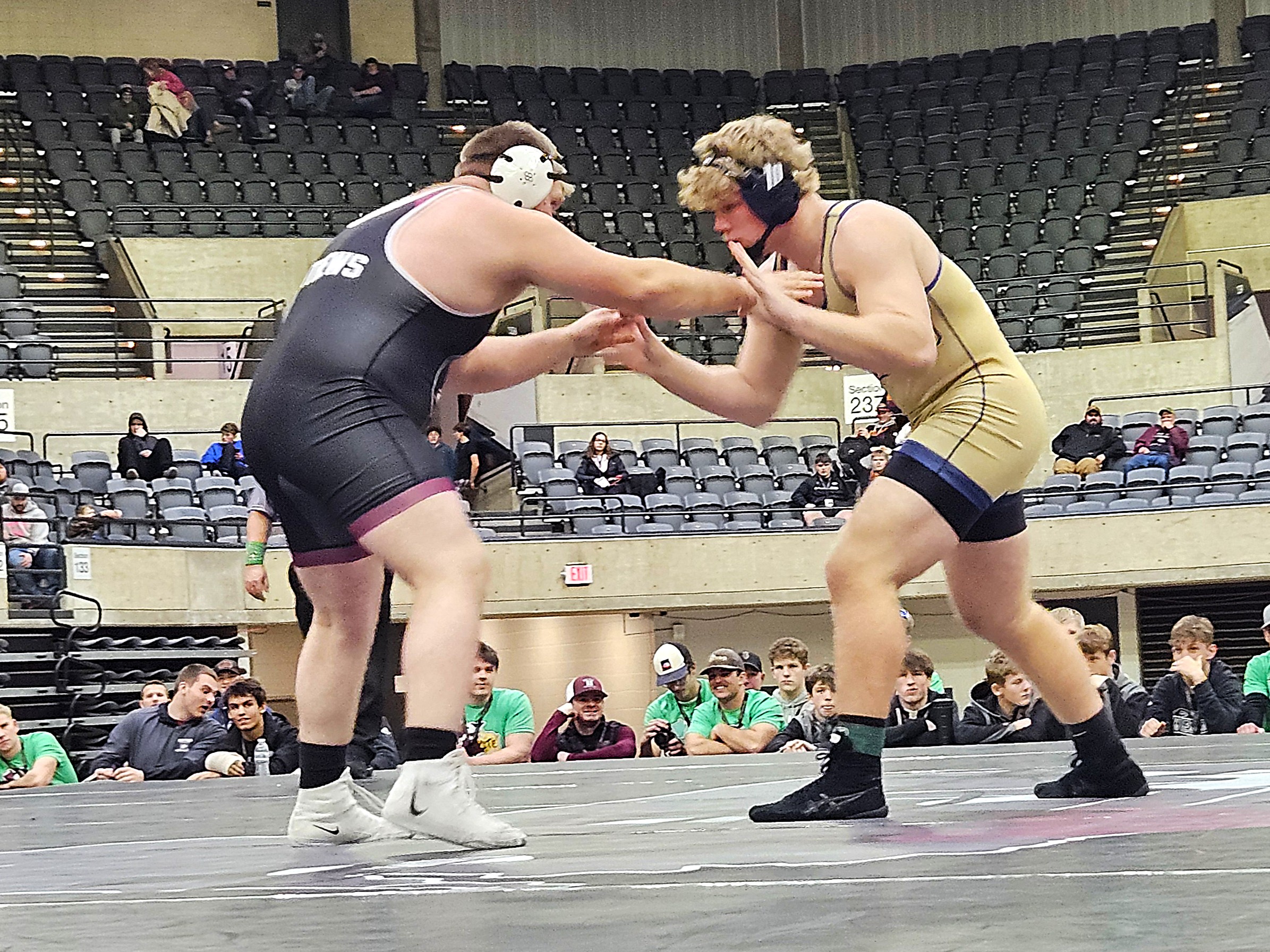 Aquinas senior Tyson Martin wrestles against Riverdale's Grant Mathews for the 285-pound championship at the Bi-State Classic. -- TODD SOMMERFELDT PHOTO