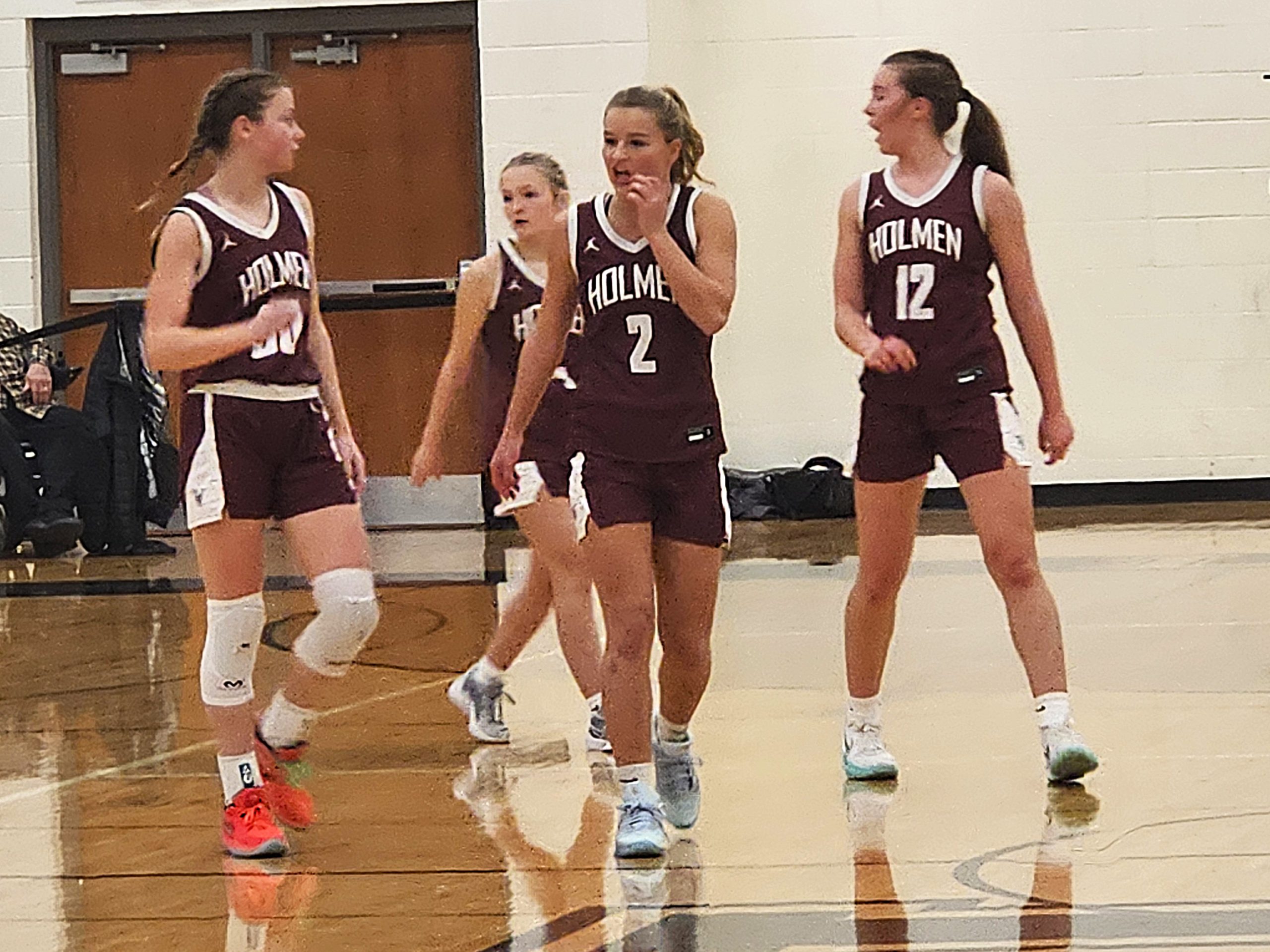 The Holmen girls basketball lineup walks back to the court during Friday's nonconference win at Onalaska Luther. -- TODD SOMMERFELDT PHOTO