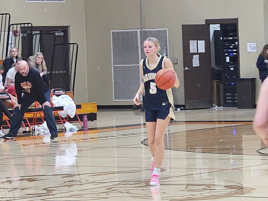 Aquinas junior Ava Fernholz walks the basketball up the floor during a game at West Salem on Saturday. -- TODD SOMMERFELDT PHOTO