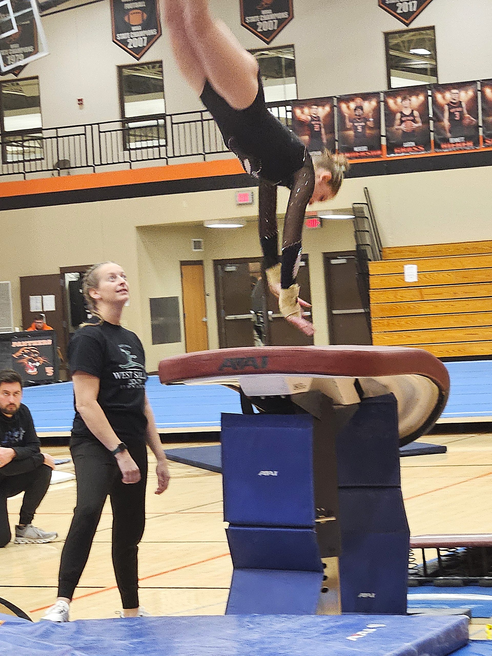 West Salem co-op gymnastics coach Carrie O'Hearn watches one of her vaulters during a meet in West Salem. -- TODD SOMMERFELDT PHOTO