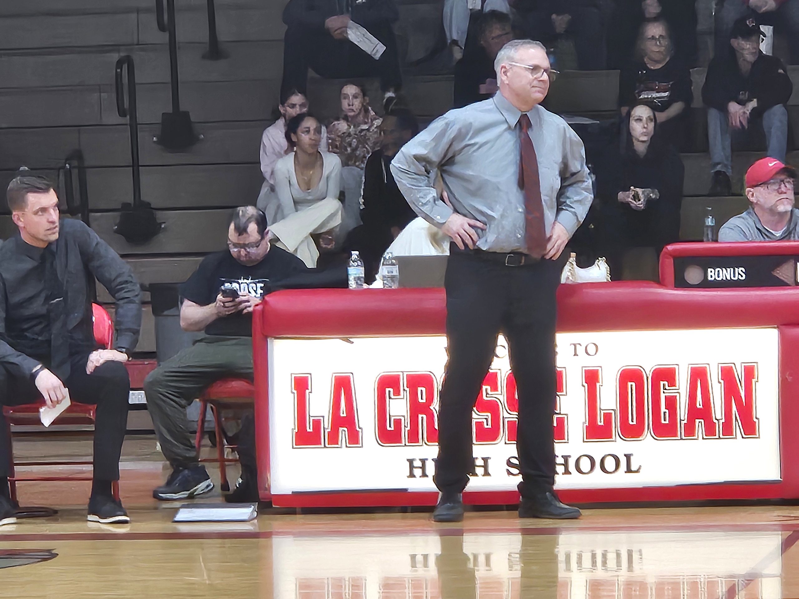 Central boys basketball coach Todd Fergot watches his team play Logan on Tuesday. -- TODD SOMMERFELDT PHOTO