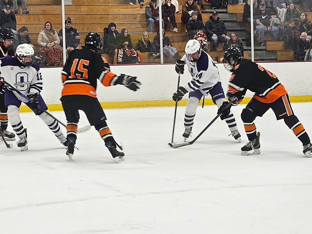 Onalaska/La Crosse's Zach Marso gets control of the puck between two West Salem/Bangor defenders at the OmniCenter. -- TODD SOMMERFELDT PHOTO