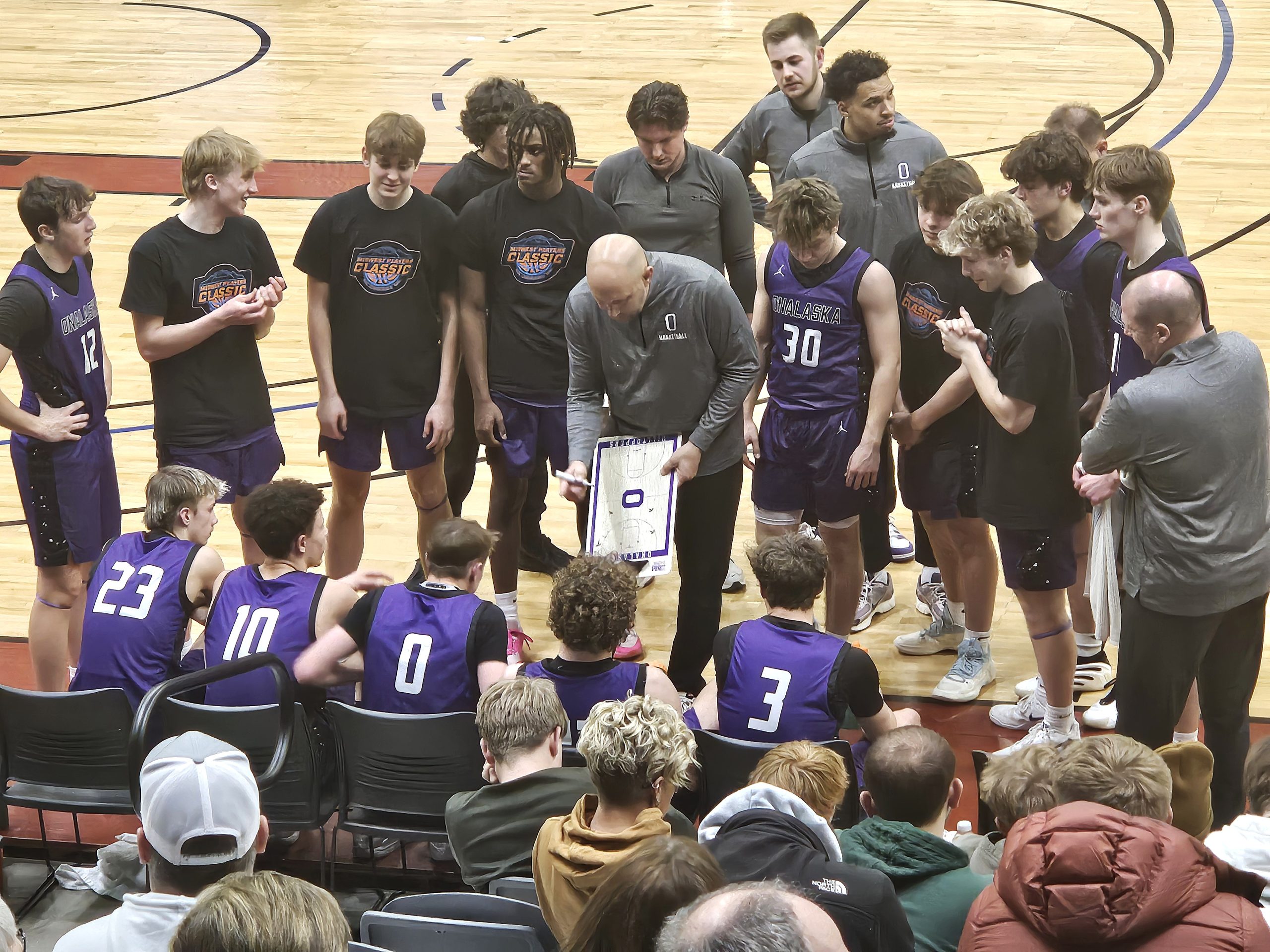 Onalaska boys basketball coach Craig Kowal makes a point to his team during a timeout in a game against Caledonia. -- TODD SOMMERFELDT PHOTO