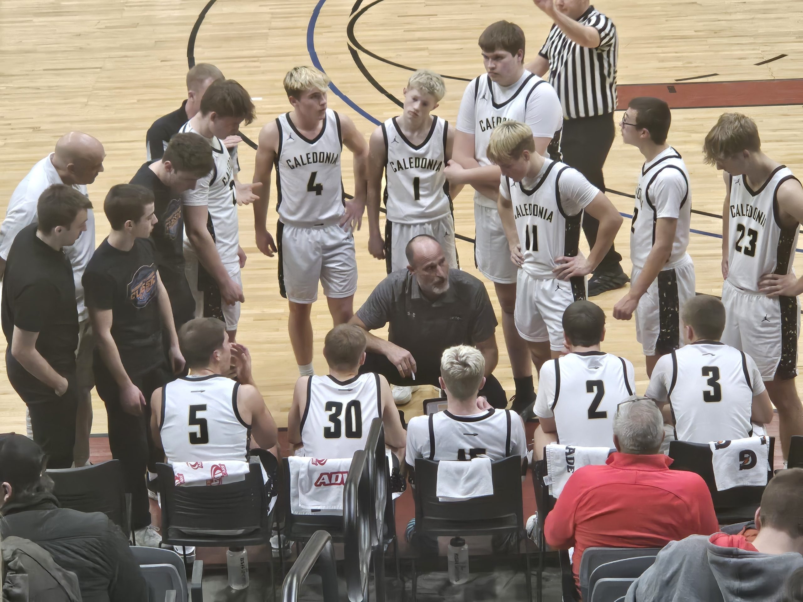 Caledonia boys basketball coach Brad King talks to his players during the Midwest Players Classic. -- TODD SOMMERFELDT PHOTO