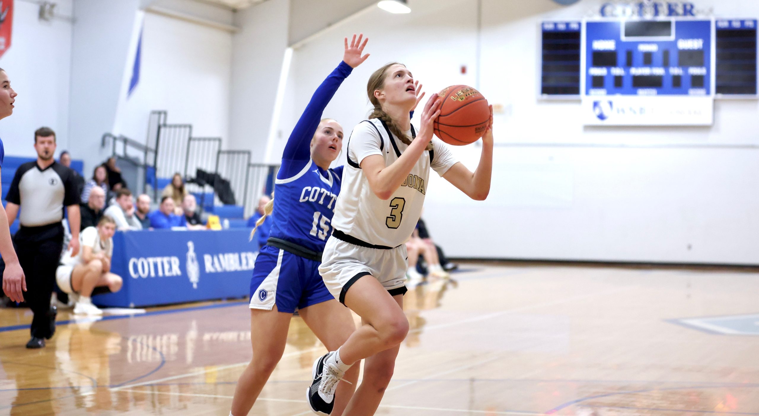Caledonia senior Aubrie Klug drives to the basket for the points that made her the program's leading career scorer. -- CRAIG JOHNSON PHOTO