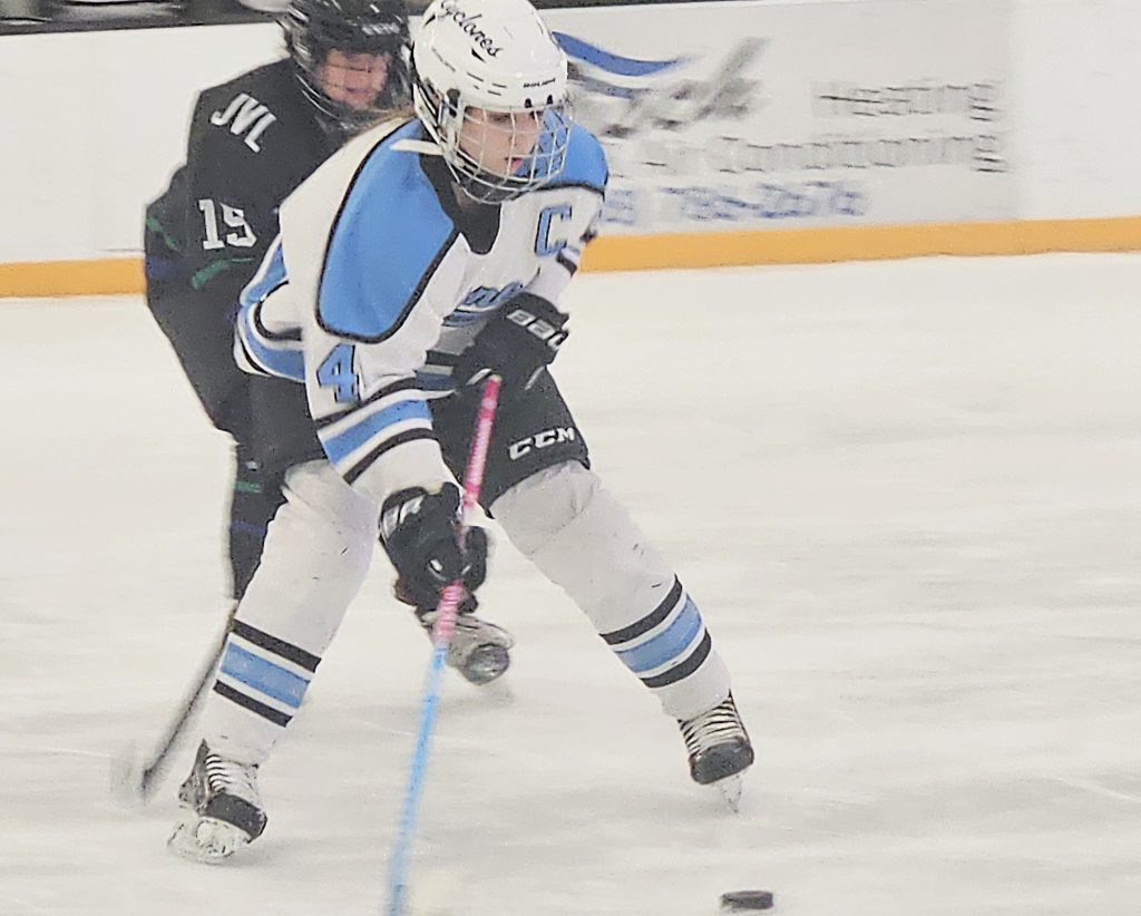 Coulee Region's Brooke Borkenhagen controls the puck against Janesville at the Panther Den on Saturday. -- TODD SOMMERFELDT PHOTO