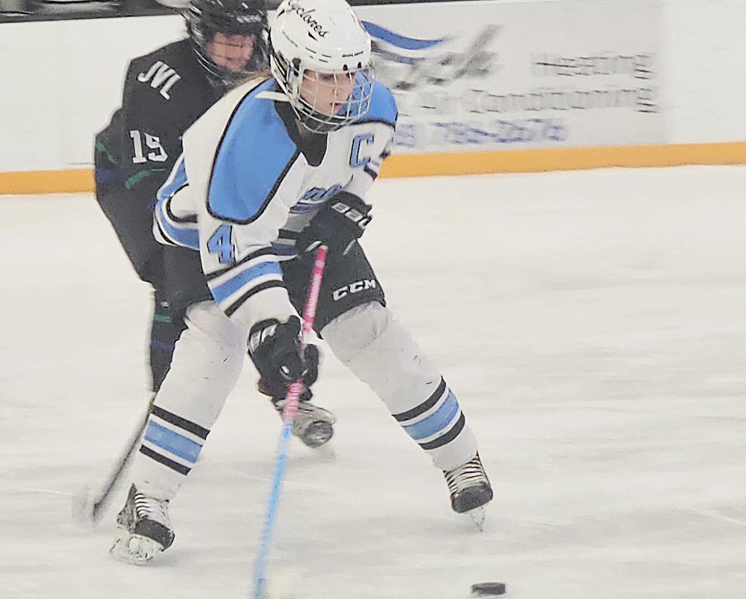 Coulee Region's Brooke Borkenhagen controls the puck against Janesville at the Panther Den on Saturday. -- TODD SOMMERFELDT PHOTO