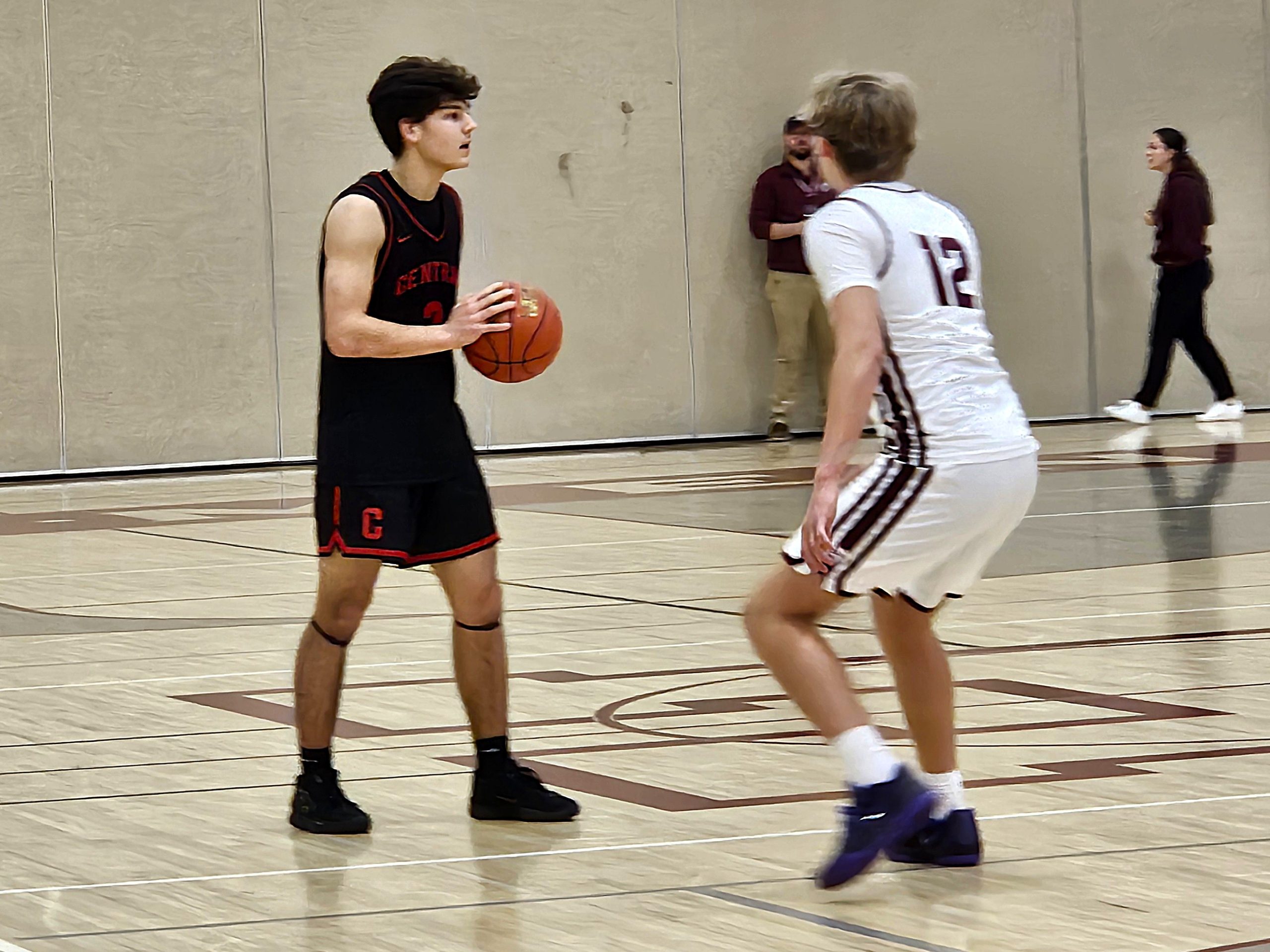 Central junior Gabe Servais controls the ball during an MVC basketball game at Holmen. -- TODD SOMMERFELDT PHOTO