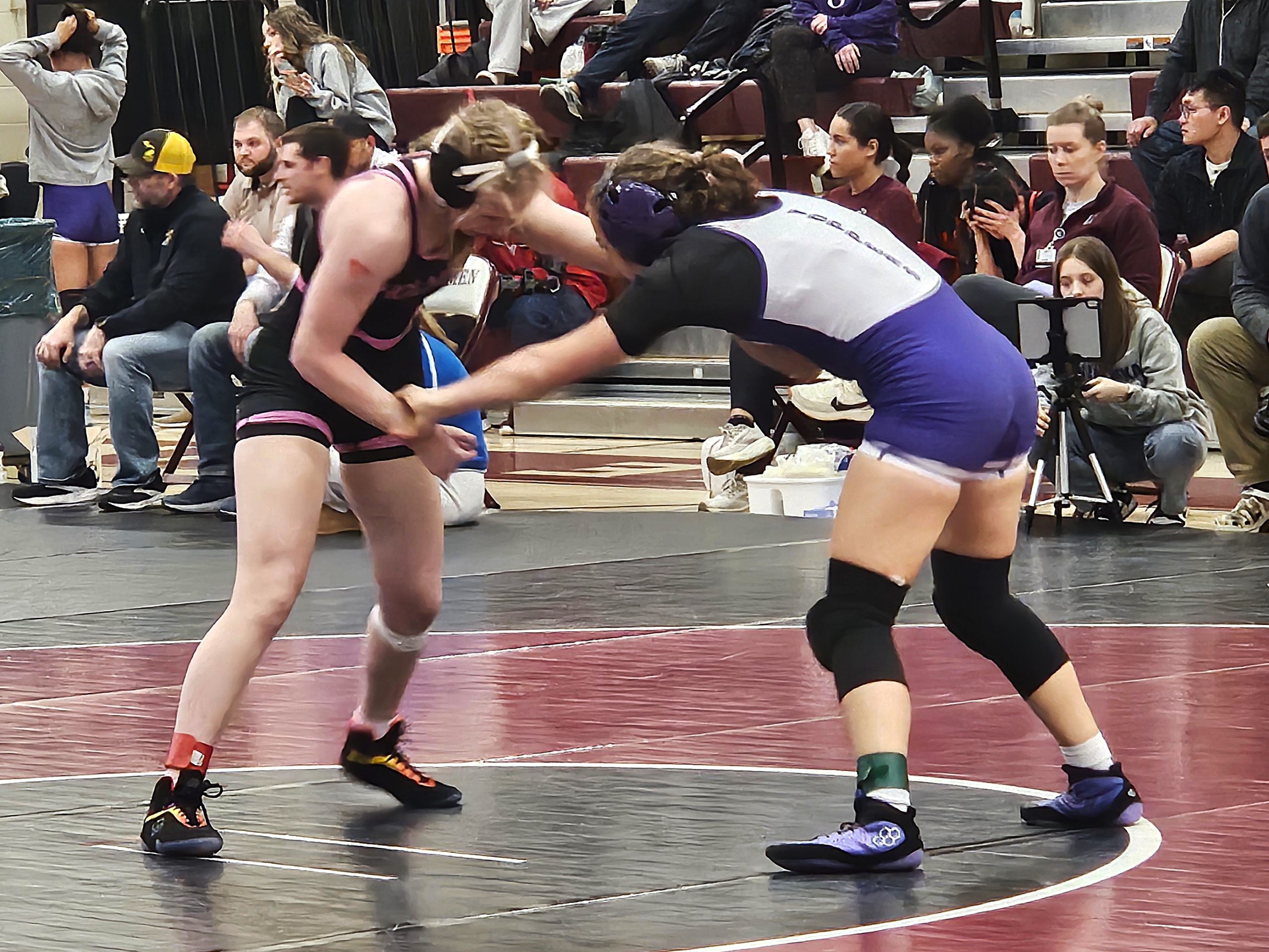 Holmen junior Kaytlynn Lambries battles Onalaska/Luther's Megan Ramsay for the 126-pound championship during a WIAA regional meet in Holmen. -- TODD SOMMERFELDT PHOTO
