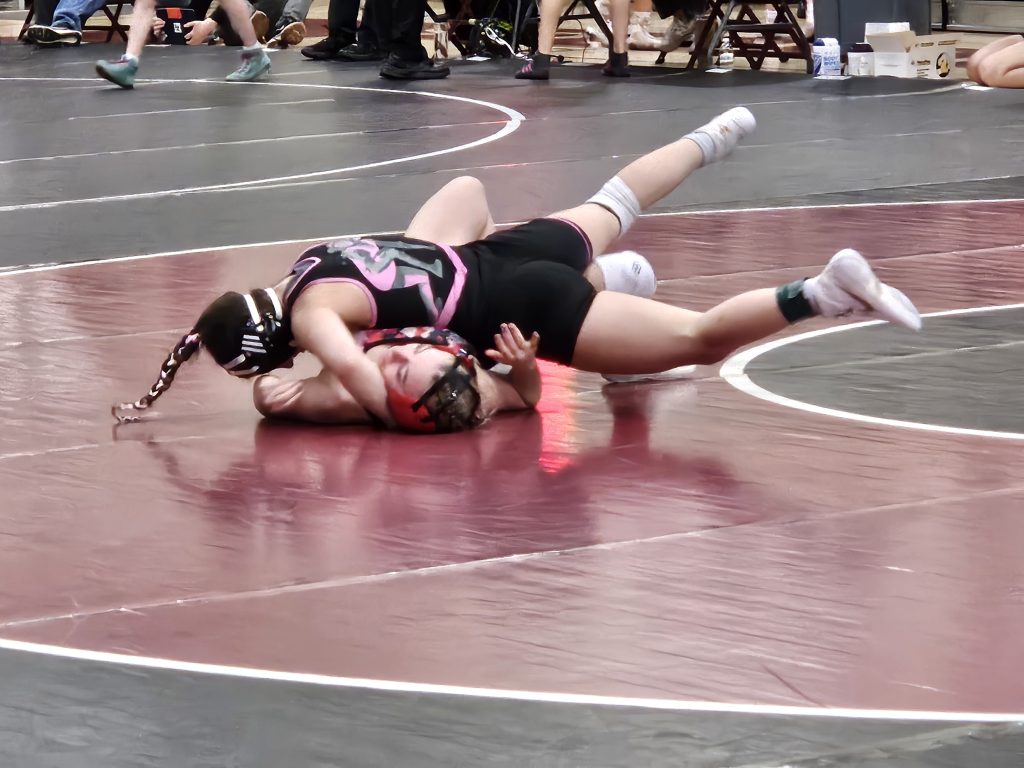 Holmen senior Peyton Kratochvill goes for the pin during a 114-pound match at a WIAA girls wrestling regional at the Bernie L. Ferry Fieldhouse. -- TODD SOMMERFELDT PHOTO
