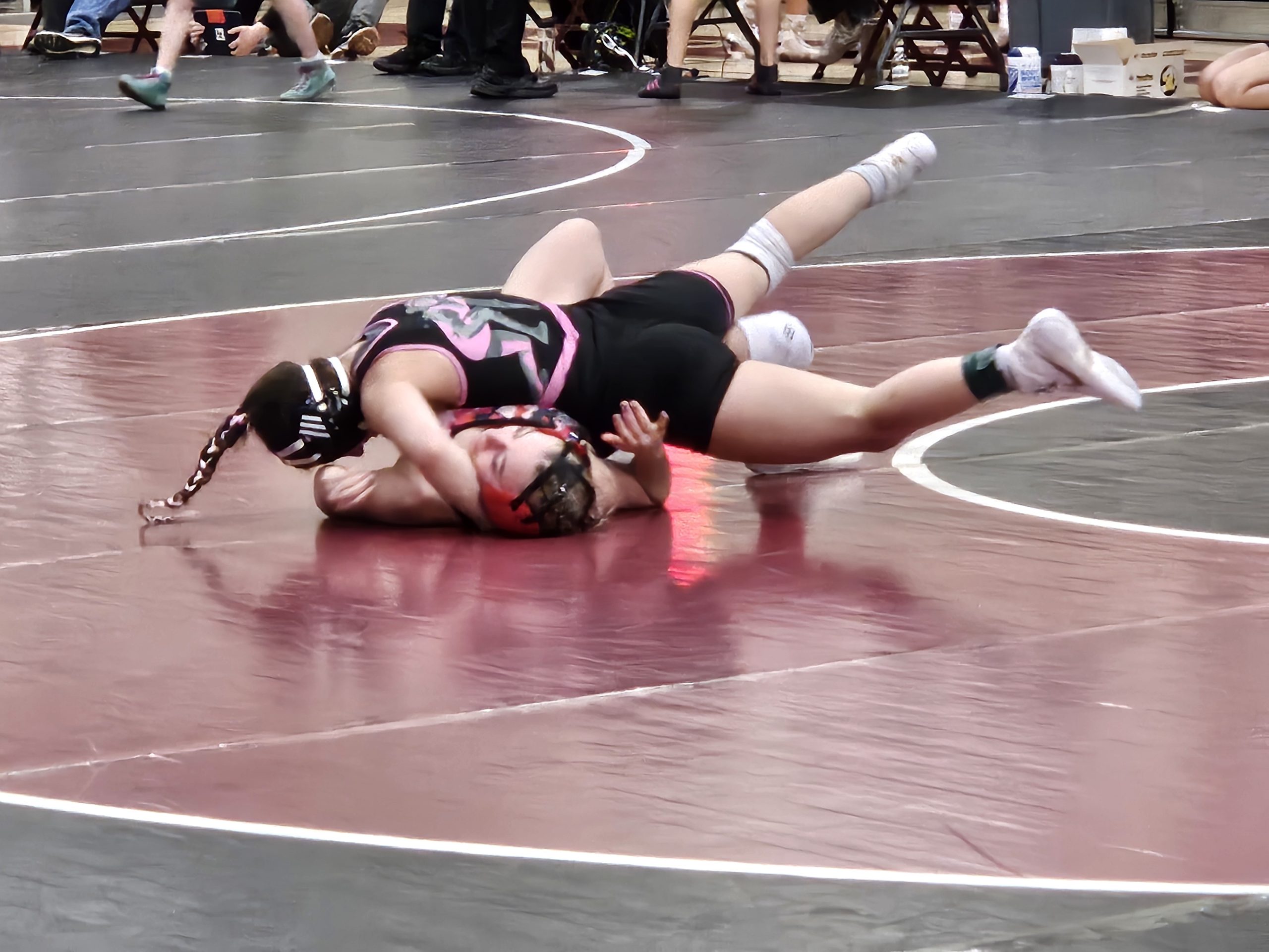 Holmen senior Peyton Kratochvill goes for the pin during a 114-pound match at a WIAA girls wrestling regional at the Bernie L. Ferry Fieldhouse. -- TODD SOMMERFELDT PHOTO