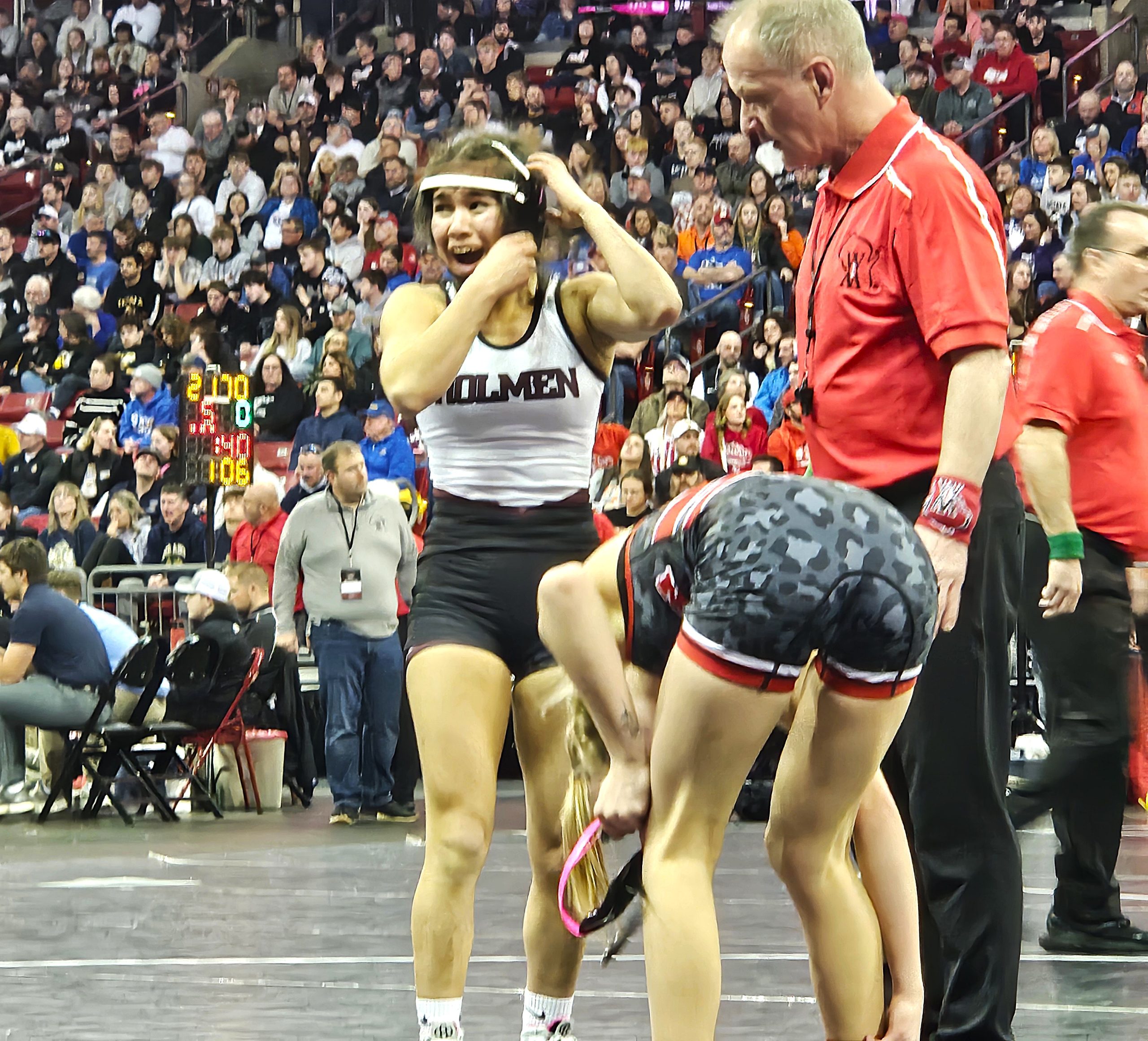 Holmen junior Aini Anderson reacts after winning her 100-pound semifinal match at the Kohl Center on Friday. -- TODD SOMMERFELDT PHOTO