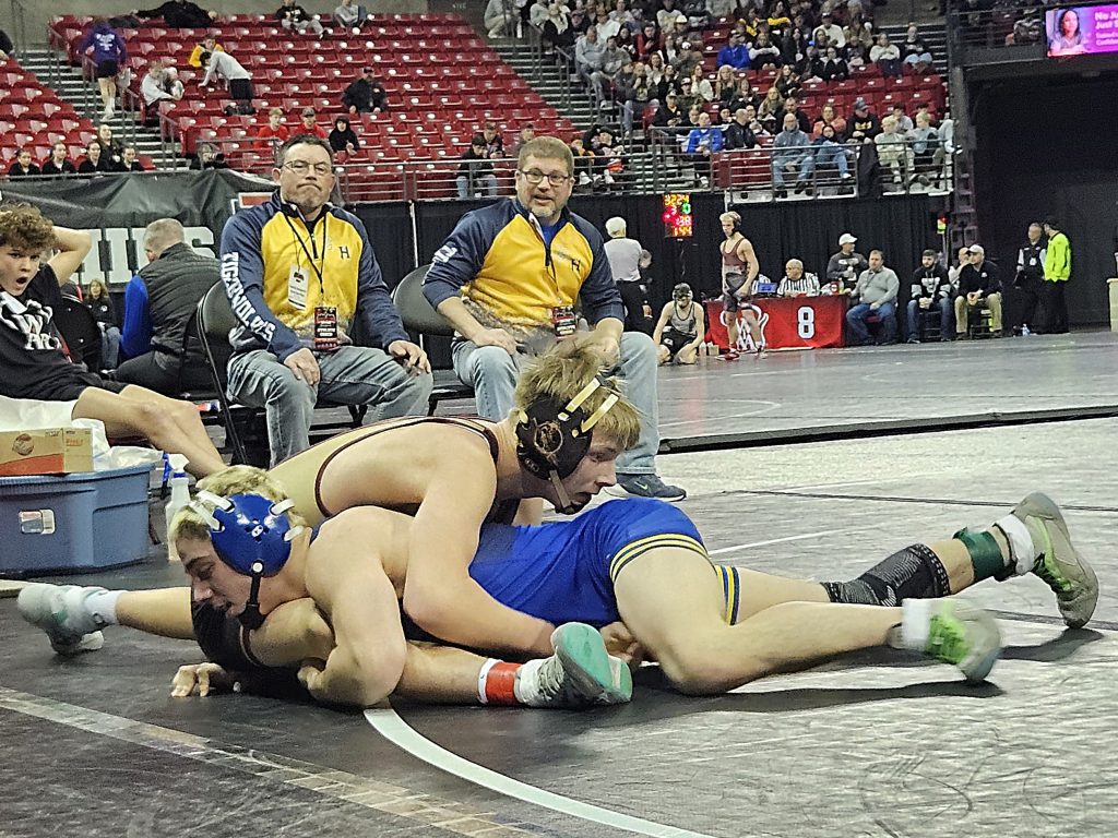 G-E-T/Melrose-Mindoro junior Brody Banse fights off a takedown during a Division 2 144-pound consolation match at the Kohl Center on Saturday. -- TODD SOMMERFELDT PHOTO