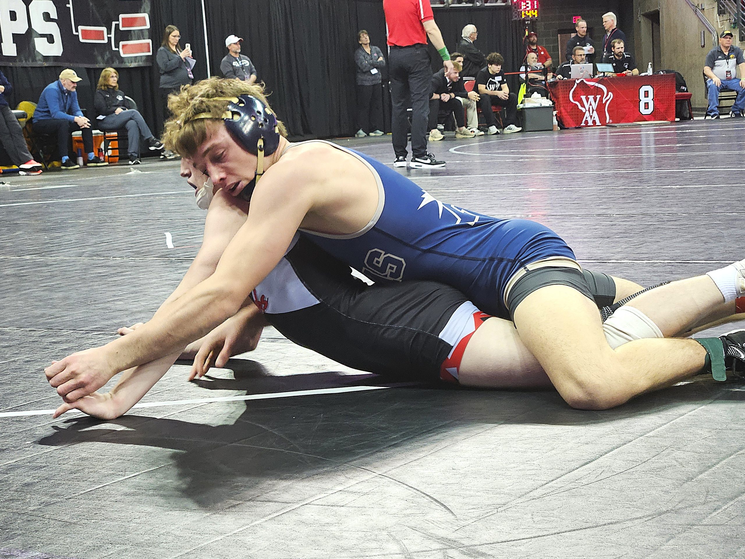Aquinas senior Roger Flege has control of his Division 3 144-pound semifinal match during the WIAA individual state wrestling tournament on Friday. -- TODD SOMMERFELDT PHOTO