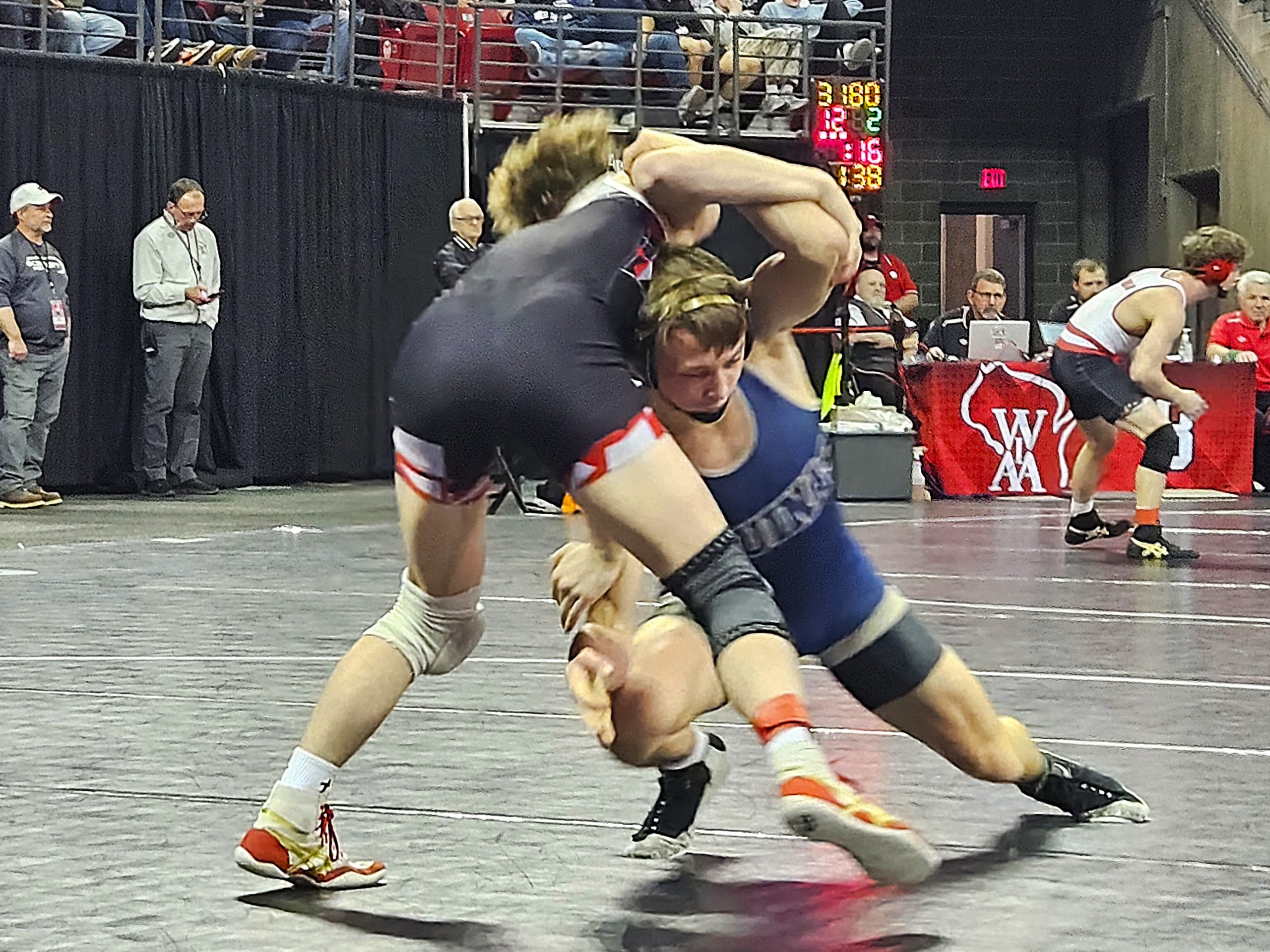 Aquinas senior Roger Flege controls his Division 3 144-pound semifinal at the Kohl Center in Madison. -- TODD SOMMERFELDT PHOTO