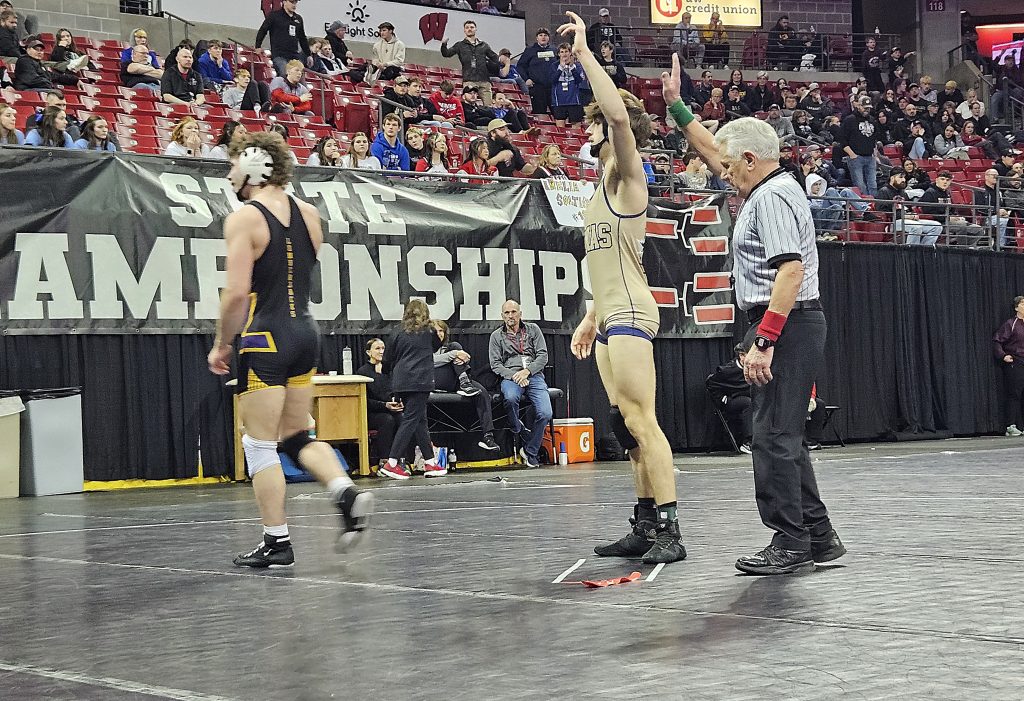 Aquinas senior Waylon Hargrove wins his third-place match at the Kohl Center on Saturday. -- TODD SOMMERFELDT PHOTO