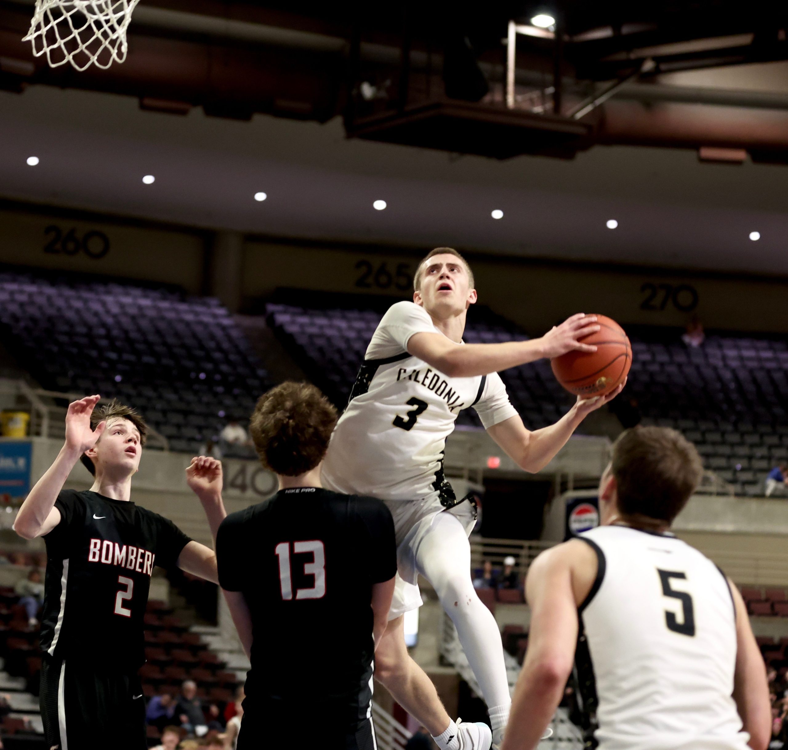 Caledonia sophomore Grant King goes up for a shot during Tuesday's MSHSL Section 1AA victory over third-seeded Cannon Falls. -- CRAIG JOHNSON PHOTO