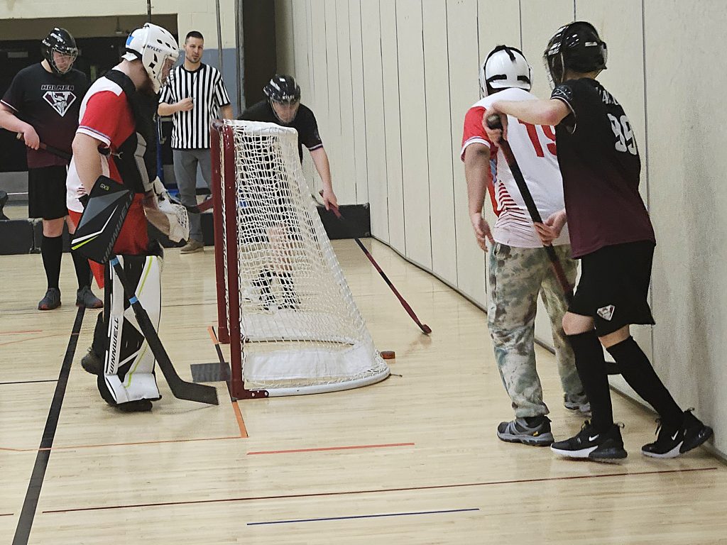 Logan at Holmen ASL floor hockey. -- TODD SOMMERFELDT PHOTO