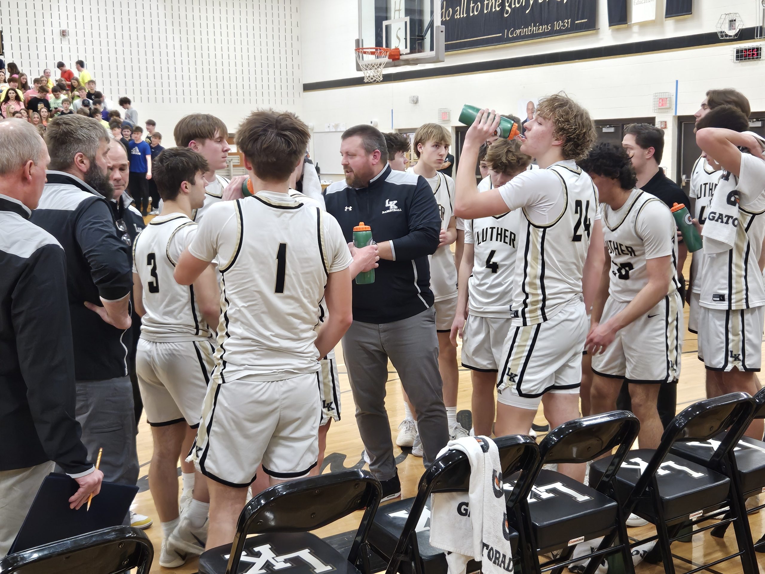 The Luther boys basketball team talks during a timeout in Tuesday's WIAA Division 4 regional game against Spring Valley. -- TODD SOMMERFELDT PHOTO