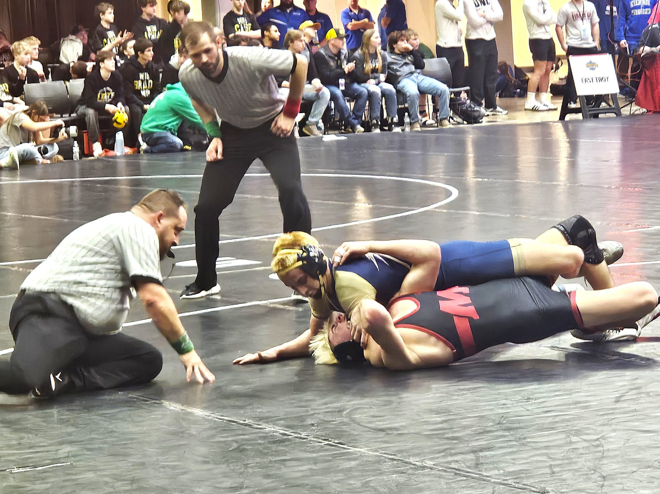 Aquinas junior Grady Nicklay goes for a pin at 157 pounds in his team's Division 3 quarterfinal dual win over Marathon in the WIAA team state tournament at the La Crosse Center. -- TODD SOMMERFELDT PHOTO