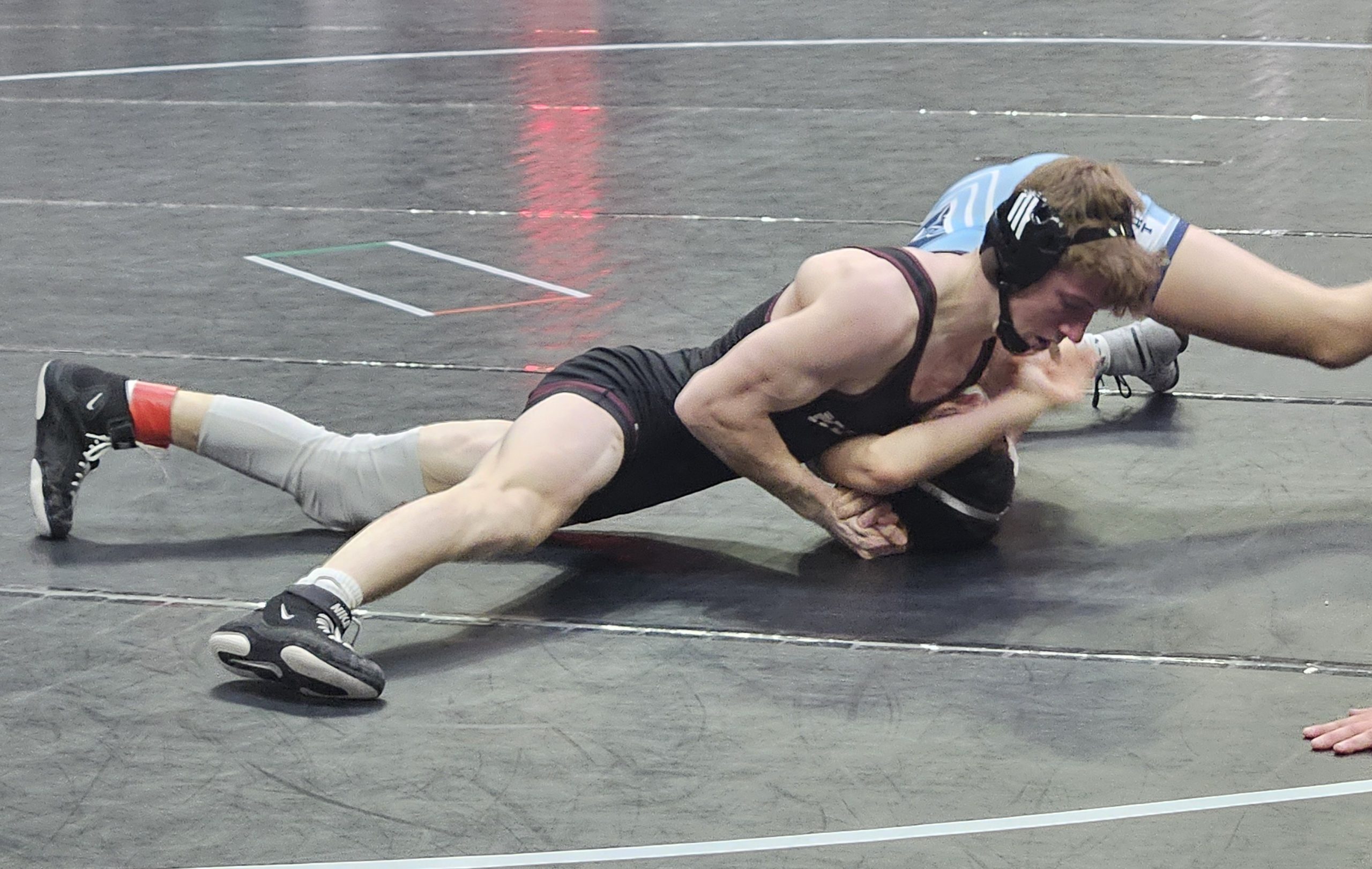 Holmen junior Brock Needham has control in his 126-pound match against Bay Port in a WIAA Division 1 state semifinal at the La Crosse Center. -- TODD SOMMERFELDT PHOTO