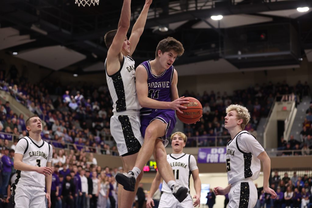 Caledonia defensers surround the play during Thursday's MSHSL Section 1AA championship game against Goodhue. -- CRAIG JOHNSON PHOTO