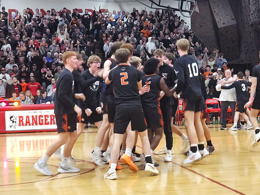 The West Salem boys basketball team celebrates its 73-70 win over Central in a WIAA Division 2 sectional semifinal at Logan on Thursday. -- TODD SOMMERFELDT PHOTO