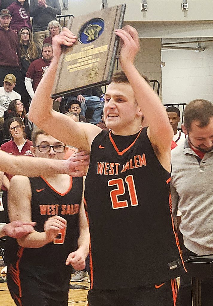 West Salem senior Nate Dillaber holds up his team's award for winning a WIAA Division 2 sectional championship. -- TODD SOMMERFELDT PHOTO