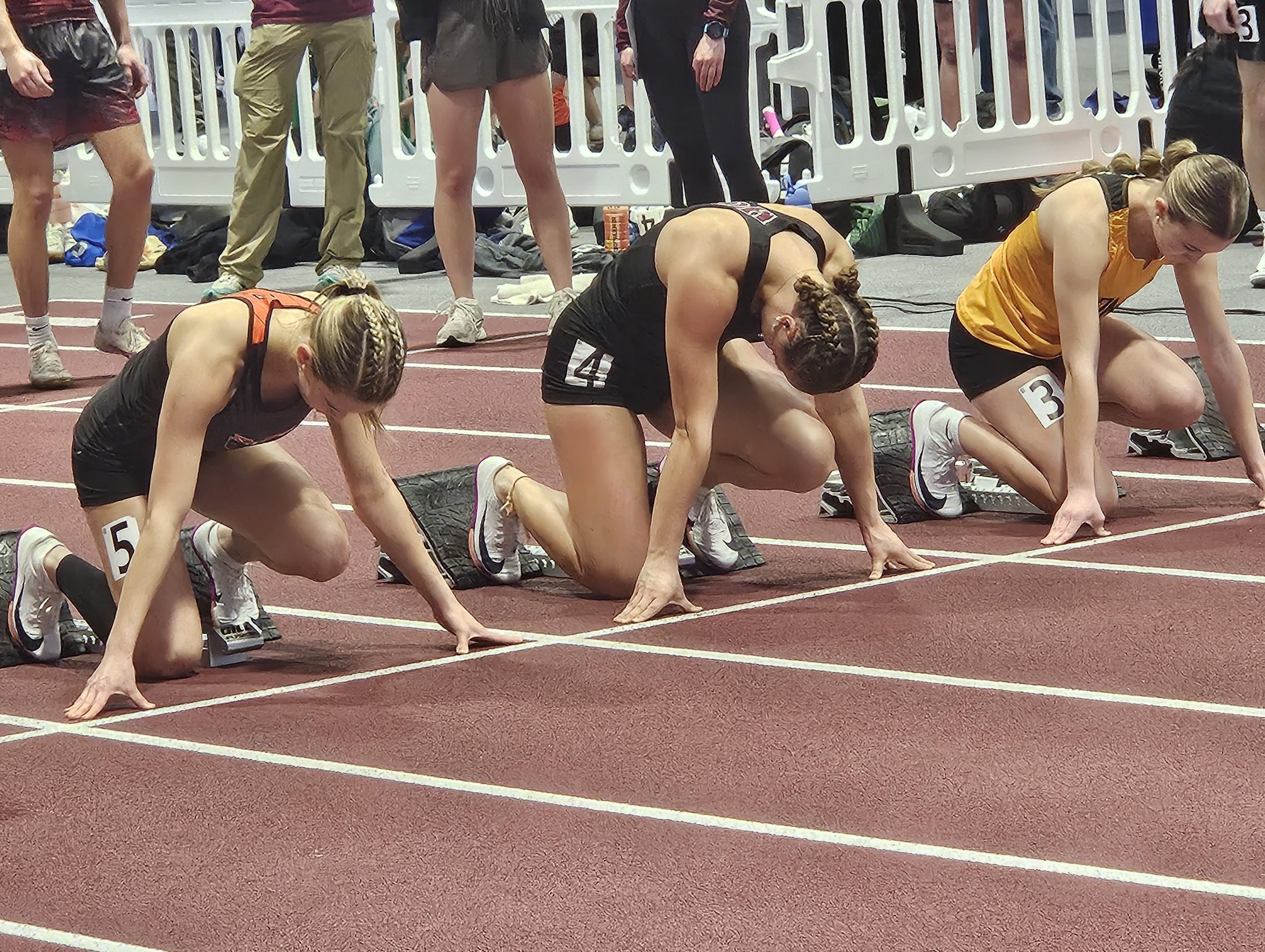 Holmen senior Lydia Lazarescu (middle) awaits the start of her 55-meter dash heat during the Mauston Invitational on Saturday. -- TODD SOMMERFELDT PHOTO