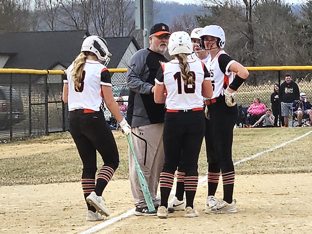 West Salem softball coach Brian Babiash talks to his players during the sixth inning of Monday's game against Arcadia. -- TODD SOMMERFELDT PHOTO