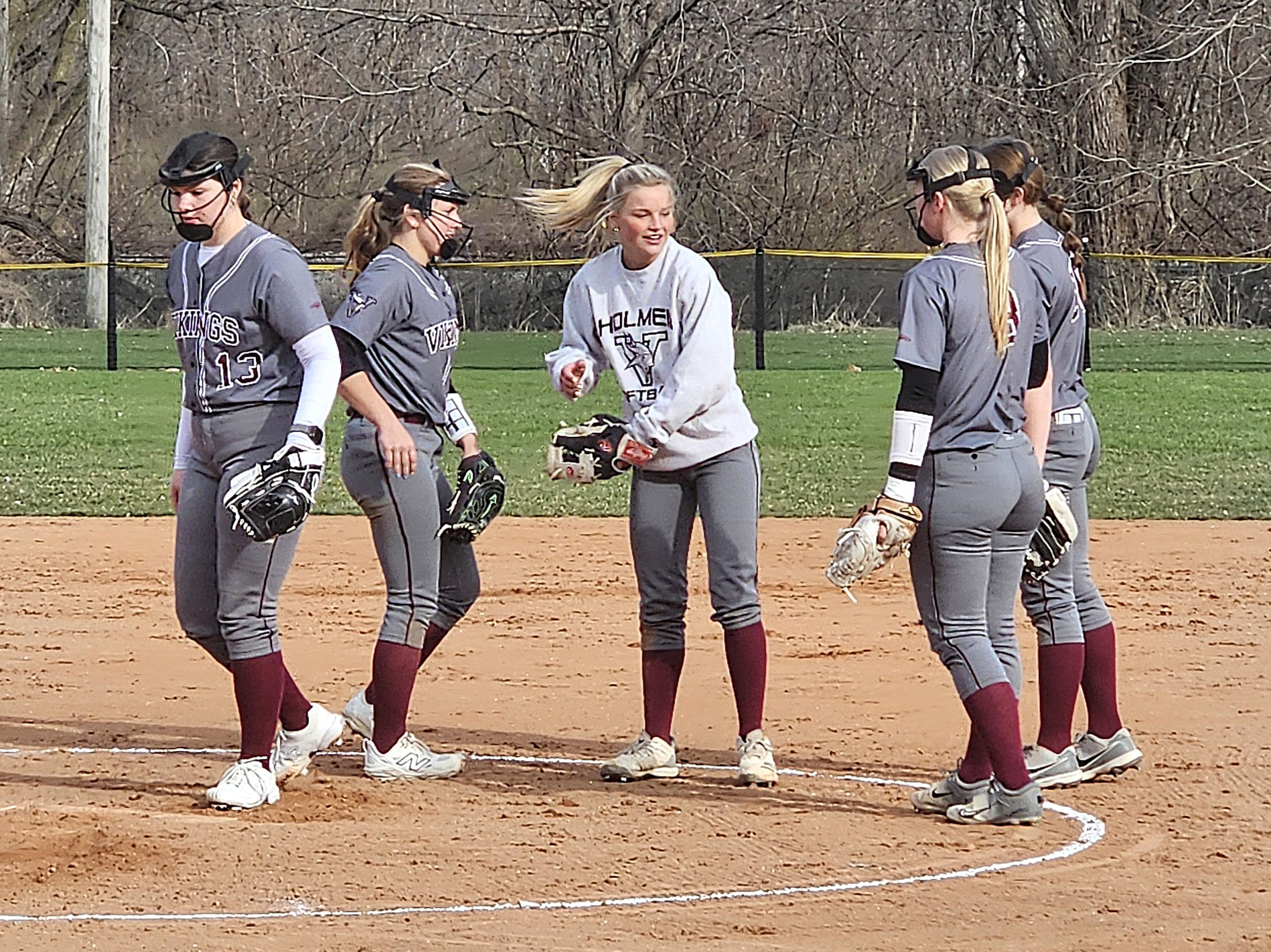Holmen infielders gather in the pitcher's circle before the start of an inning against Logan. The Vikings won 16-5. -- TODD SOMMERFELDT PHOTO